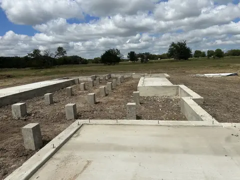 Concrete piers viewed from one end of the East Texas foundation.