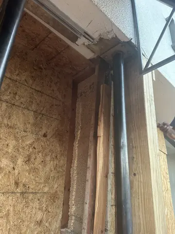 New beam and plywood work at the storefront repair opening.