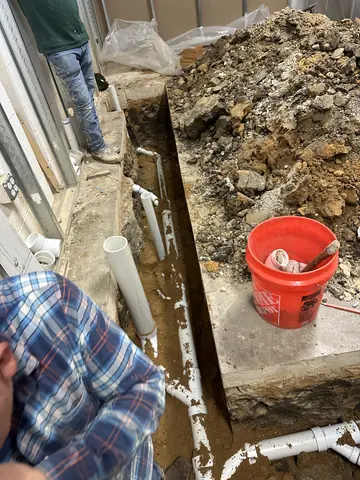 Floor excavation documented during the commercial build-out.