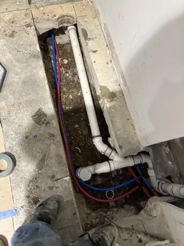 Floor trench showing pipework before closing the floor.