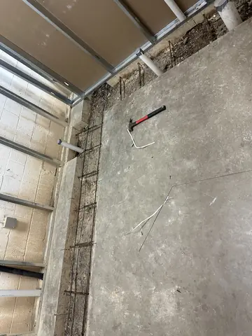 Steel framing and prepared wall surface during the build-out.