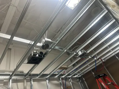 Ceiling framing and mechanical equipment during construction.