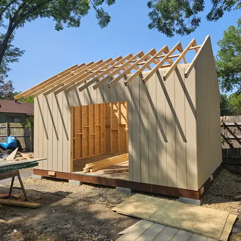 Storage-building roof rafters before roofing is installed.