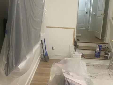 Detail of wall paneling, chair rail, and floor protection.