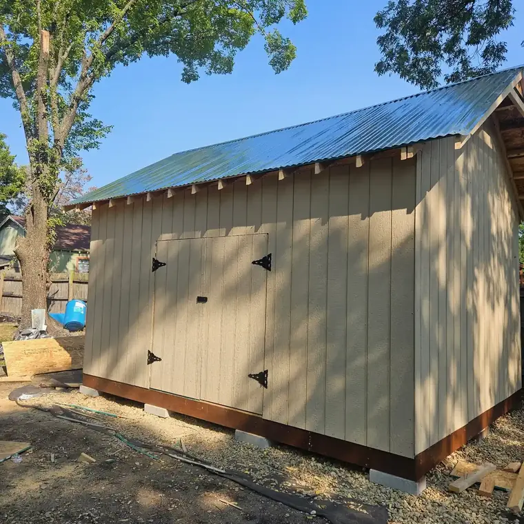 Finished board-and-batten storage building with a standing-seam metal roof