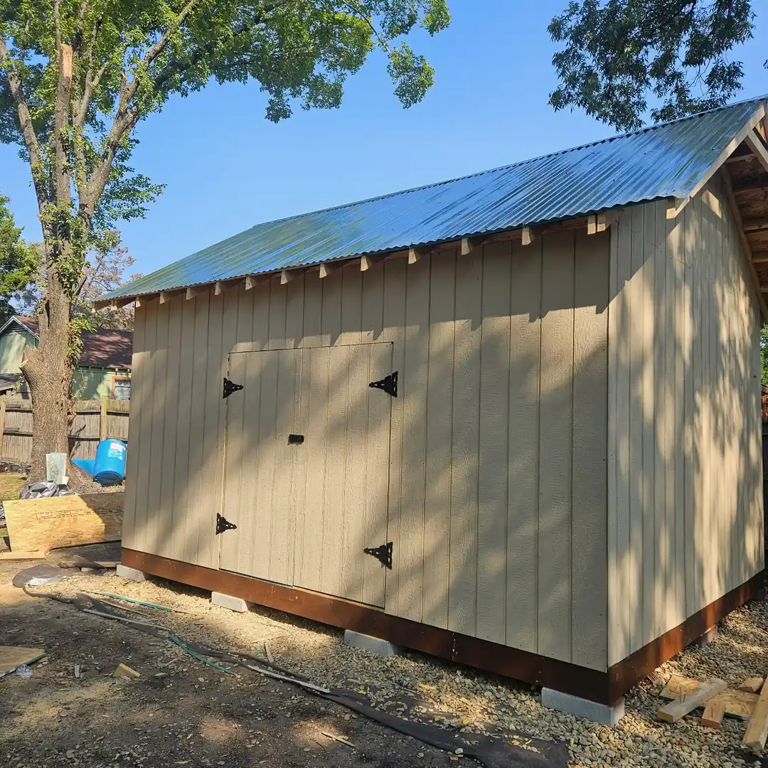 Finished board-and-batten storage building with a standing-seam metal roof
